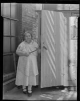 "Apple Annie" next to her fruit stand the day after a robbery, Los Angeles, 1935