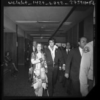 Elvis and Priscilla Presley leaving courtroom after divorce hearing in Santa Monica, Calif., 1973