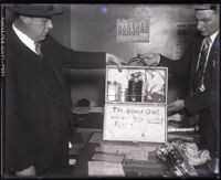 Policemen with the briefcase bomb used in an attempted bank robbery, Los Angeles, 1931