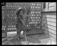 David Durand waters some plants, Los Angeles, 1926