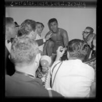 Cassius Clay giving press conference after he KO'd Archie Moore, 1962