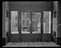 Looking outside from an entrance of the unfinished California State Building in downtown Los Angeles, early 1930s