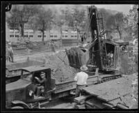 Steam shovel begins excavation for the new Frank Wiggins Trade School Building, Los Angeles, 1926