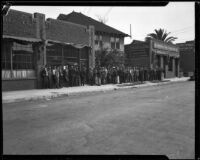 Unemployed men line up to register for work on San Pedro St., Los Angeles, 1929-1939