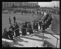 Graduates of Loyola College walk away from commencement ceremony, Los Angeles, 1935