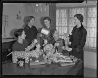 Mrs. Martin Askey, Elizabeth Scattergood, Marjorie Martin, Mrs. J. Thomas Mahl, and Lucile Criley Moon with toys and stuffed animals they will be donating to needy children, 1935