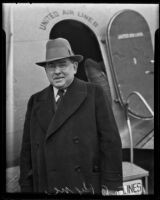 Author Peter B. Kyne stepping in front of an airplane, Los Angeles, 1930s