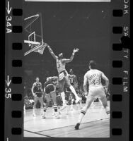 Wilt Chamberlain making a dunk during Los Angeles Lakers vs Milwaukee Bucks game, 1971