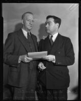 William Whitman, twice acquitted for the same murder, stands with his attorney, Los Angeles, 1935