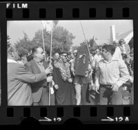 Rabbi Ovadia Yosef leading parade along Sierra Bonita Ave. during visit to Los Angeles, Calif., 1975