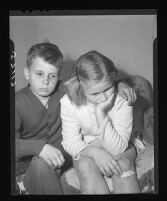 Stanley Lyon and Barbara Fiscus wait to hear the fate of their cousin and sister, respectively, Kathy Fiscus, 1949