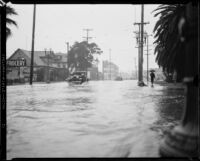 Rain-flooded city street, [Los Angeles County?], 1933