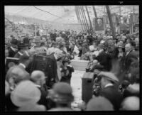 Crowd watches as Mrs. E. E. Remsberg speaks to her brother, President Warren G. Harding, and other prominent people listen in, Anaheim, 1921