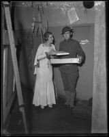 Harold Meyers, veteran, receives Christmas gifts from Aimee Semple McPherson-Hutton, Los Angeles, 1933