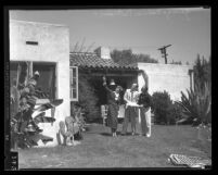 Amelia Earhart, George P. Putman and Paul Mantz inspecting Earhart's new home in Los Angeles, Calif., 1935