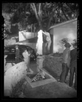 Police photographing body of Sam Rummel at scene of death in Los Angeles, Calif., 1950