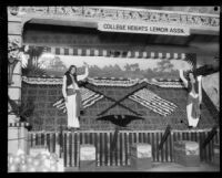 Two women stand in front of the College Heights Lemon Association booth at the Los Angeles County Fair, Pomona, 1929