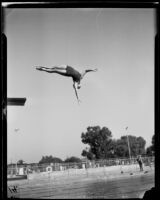 Dorothy Poynton, Olympic diver, in straight position following a backward start, 1932