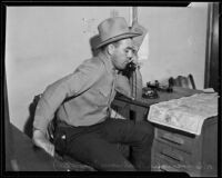 Sheriff R. S. Snedigar talks on the telephone, Victorville, 1935