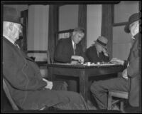 Checker champion Leonard Leslie Hall and H. P. Kidwell play separate games, surrounded by other club members, Los Angeles, 1936