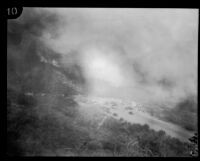 People and their vehicles gather on a road near the brush fire site in Griffith Park, Los Angeles, 1929