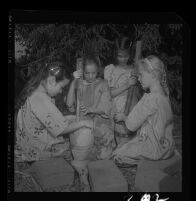 Students at University Elementary School learn African techniques of preparing food. B. 1958