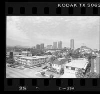 Cityscape of residential area with skyscrapers in background near Century City, Calif., 1987