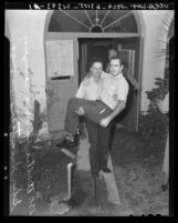 Walter Howard carrying disabled World War I veteran Glenn Switzer to vote in Duarte, Calif., 1940