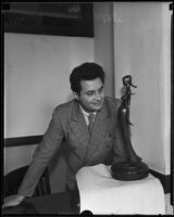 Atanas Katchmakoff, sculptor, with his bronze Madonna sculpture, Los Angeles, 1935