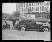 Dolores Gunn, owner of an escort service shut down for prostitution receiving a parking ticket in Los Angeles, Calif., 1943