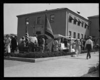 Booths in front of a building dispensing relief after the Long Beach earthquake, Southern California, 1933