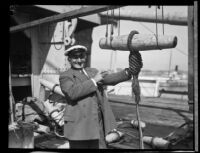 Byrd Expedition sailmaker, Martin Ronne, points to a knot, Los Angeles, 1928