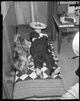 Los Angeles County sheriff Eugene Biscailuz resting under sombrero, 1958