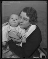 Oliver Goodrich, infant son of a County Jail inmate, with Chief Matron Vada Sullivan, Los Angeles, 1935