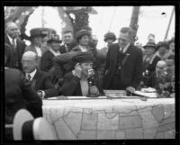 Crowd watches as Mrs. E. E. Remsberg speaks to her brother, President Warren G. Harding, and other prominent people listen in, Anaheim, 1921