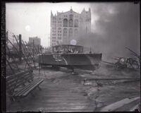 Smoldering boat at an auto show fire, Los Angeles, 1929