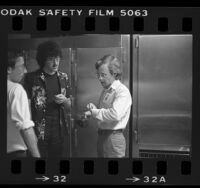 Concert promoter Tom Griffin speaking with "Weird Al" Yankovic before show at Starlight Amphitheatre in Burbank, Calif., 1984