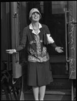 Actress Leatrice Joy in front of a train car, 1931