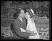 Martin W. Amador gets a kiss from Marguerite Chapman for War Bonds drive in Los Angeles, Calif., 1943