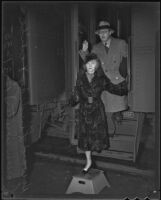 Screenwriter Howard Lindsay and wife Dorothy Stickney arrive at a train station in Los Angeles, 1935