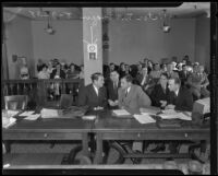 Victor McLaglen in court with his lawyers, Los Angeles, 1935