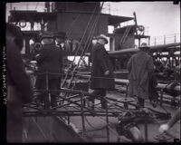 Detectives walking onto a ship to capture killer Phil Alguin, Freeport, Texas, 1923