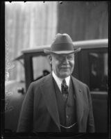 Boyle Workman in front of automobile, Los Angeles, 1929