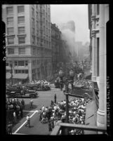 Smoke billowing from Bradbury Building as firefighters response and crowd watches in downtown Los Angeles, Calif., 1947