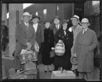 Actor Leo Carrillo, writer Frank Condon, and group near train after return from Mexico, 1936