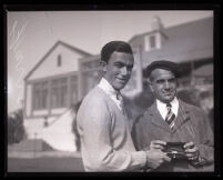 American professional golfer Johnny Farrell receives a wristwatch, circa 1922-1934