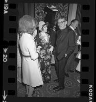 Actress Ann Blyth talking with Cardinal Timothy Manning at Ladies of Charity luncheon in Los Angeles, Calif., 1973
