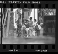 People walking around Little Tokyo in Los Angeles, Calif., 1983