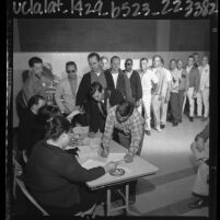 Los Angeles General Telephone Company employees waiting in line to receive ballot during 1964 strike