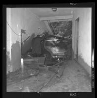 Mud and car in garage or living room after mudslide, Los Angeles, 1969